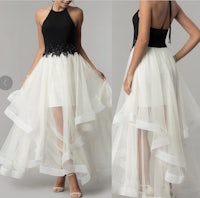a white and black tulle dress with a halter top
