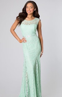 a woman in a mint green lace dress