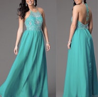 a woman in a turquoise prom dress with beading on the back
