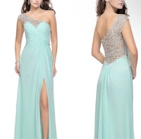 a woman in a mint green dress with a slit