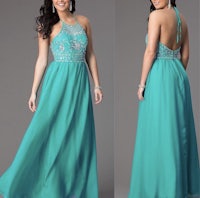 a woman in a turquoise prom dress with beading on the back